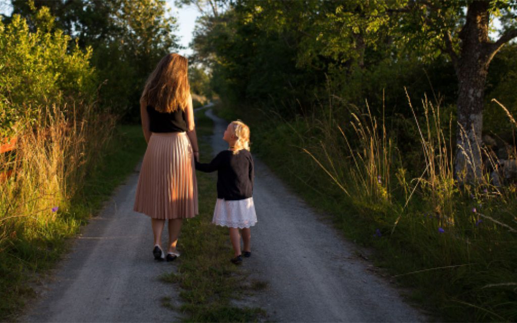 woman and girl walking