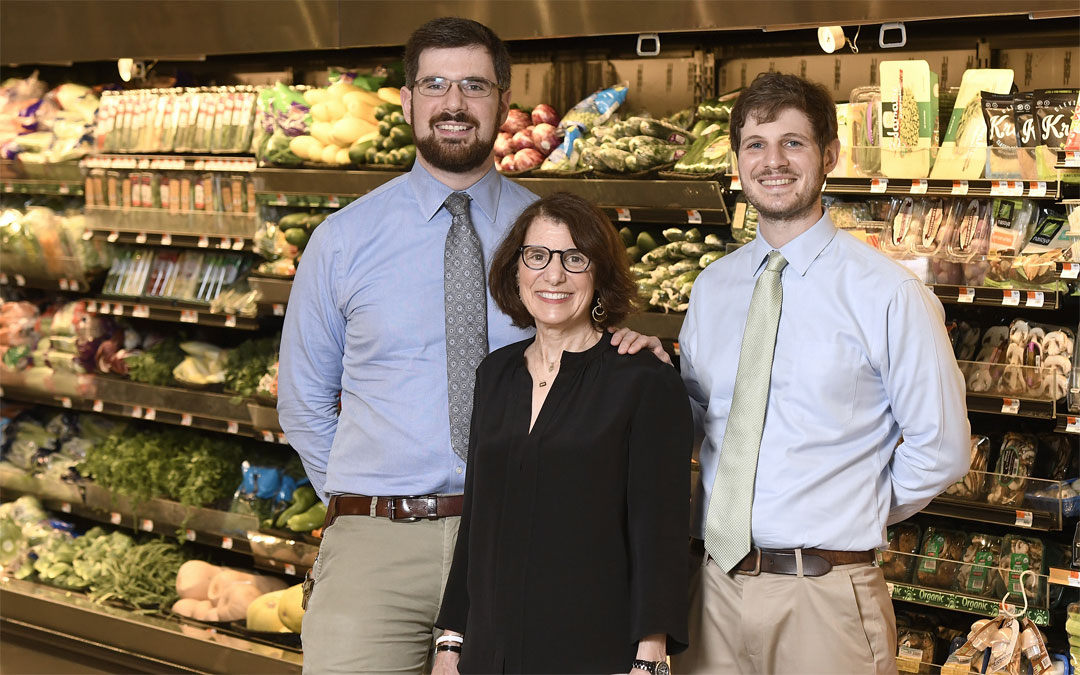 (center), with her sons and fellow store co-owners Michael Schaffer (left) and Andrew Schaffer.