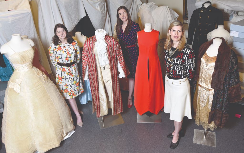 (Left to right) Emily Bach, research associate for the fashion archives at the Maryland Historical Society, Allison Tolman, acting vice president of collections, and Alexandra Deutsch, curator of the “Spectrum of Fashion: Celebrating Maryland’s Style” exhibition. (Photo by Steve Ruark)