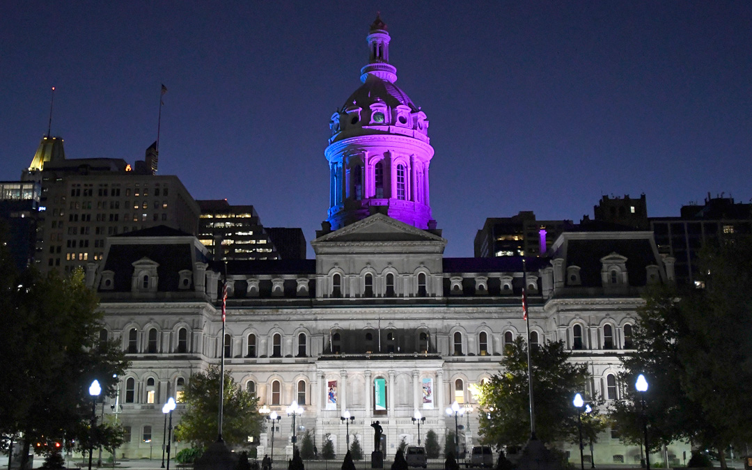 Baltimore City Hall was recently lit up in honor of those living with metastatic breast cancer. (Photo by Steve Ruark)
