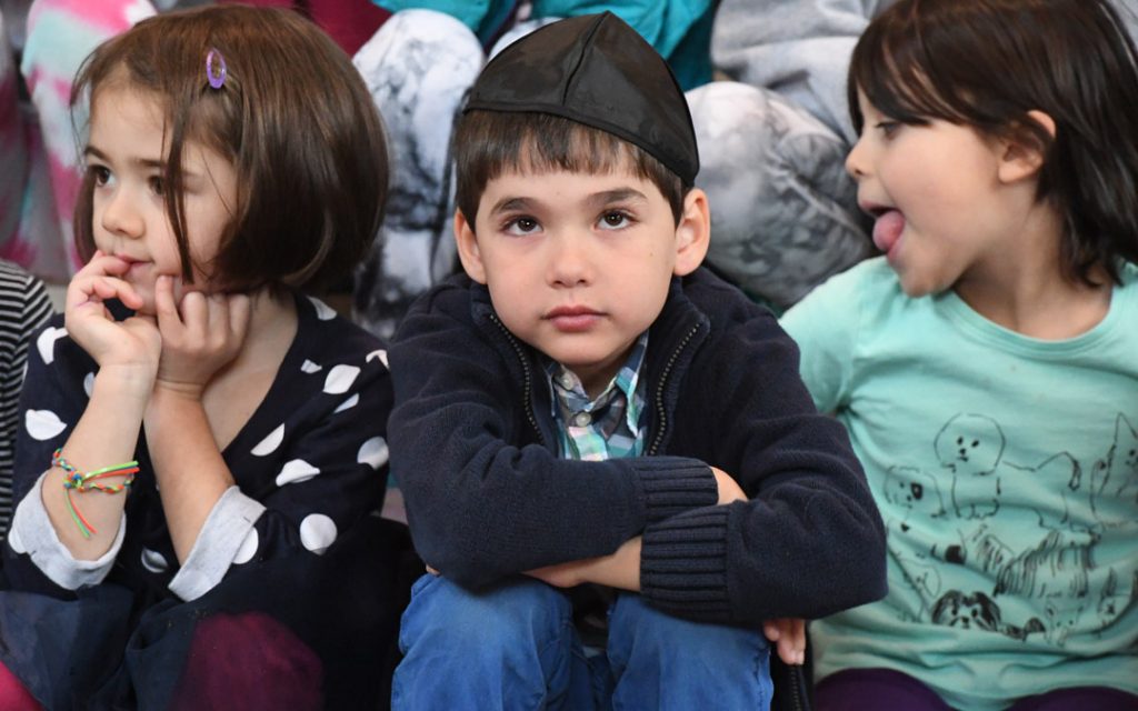 Among those enjoying the festivities was young Beth Am congregant Zachary Adler (center). (Photo by Jim Burger)