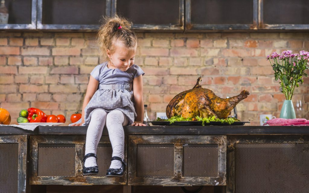 Child with Thanksgiving turkey