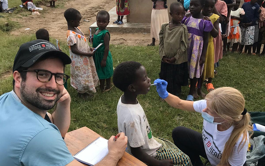 Adam Teitelman of Bridge to Health conducts outreach at an elementary school in the Uganda town of Kable.