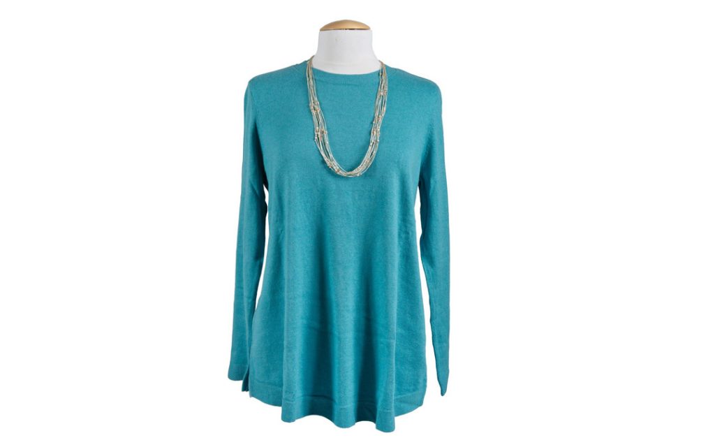 Pair this colorful A-line tunic sweater with a layered necklace for a stylish, effortless winter look. $79 at J JILL
