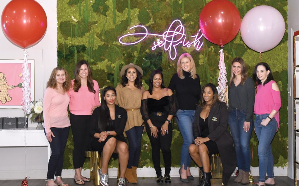 From left, Simone Ellin, Aliza Friedlander, Self.ish Beauty co-owner Keisha McClain, Ariel Lewis, Self.ish Beauty co-owner Janeen Simon, Kirsten Johnsen, Self.ish Beauty co-owner Kelley Dailey, Jenn George and Tracy Friedlander gather at the start of a "Galentine's Day" outing at Self.ish Beauty in Pikesville. (Photo by Steve Ruark)