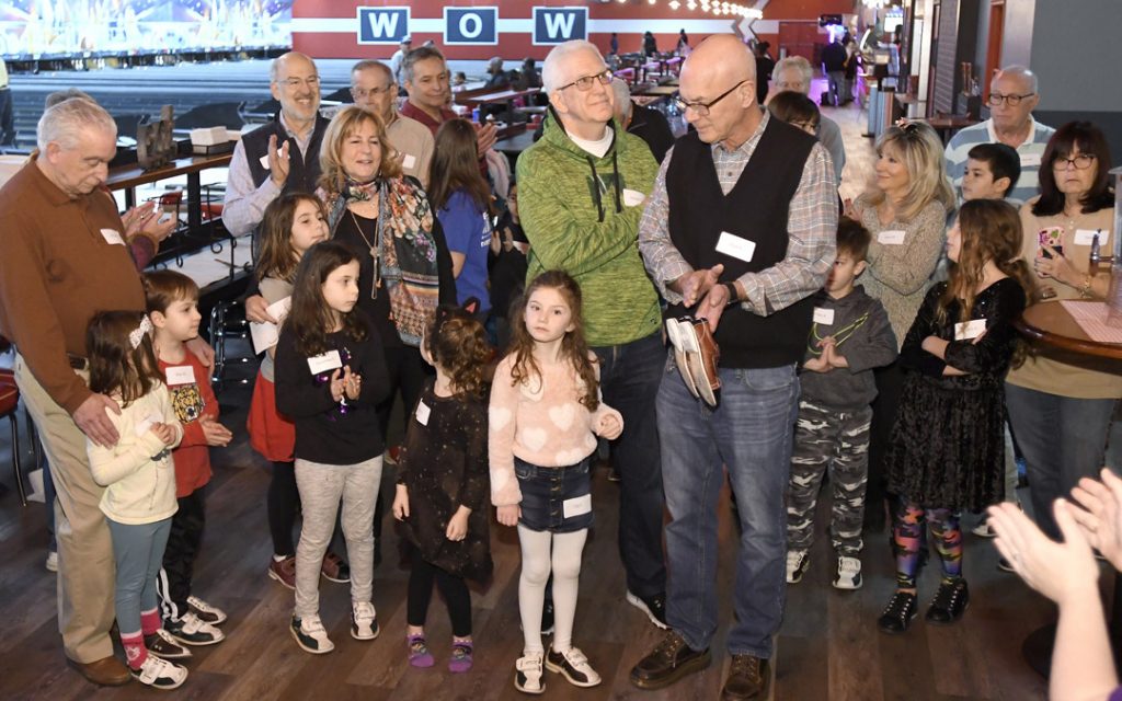 Children and their grandparents gather before bowling during the Macks Center for Jewish Education's Saba-ba: Grandparents on the Go launch party at AMF Pikesville Lanes. (Photo by Steve Ruark)