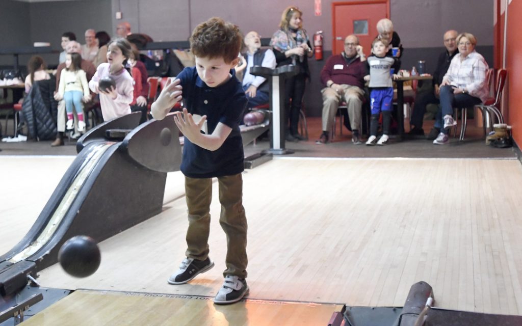 David Lowy, 6, of Pikesville, bowls during the Macks Center for Jewish Education's Saba-ba: Grandparents on the Go launch party at AMF Pikesville Lanes. The Saba-ba program brings together children and their grandparents. (Photo by Steve Ruark)