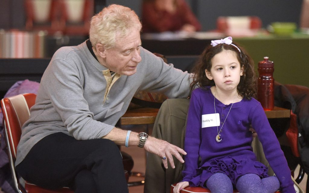 Stuart Tabb, of Reisterstown and his granddaughter Maddy Heston, 6, of Timonium, chat during the Macks Center for Jewish Education's Saba-ba: Grandparents on the Go launch party at AMF Pikesville Lanes. The Saba-ba program brings together children and their grandparents. (Photo by Steve Ruark)