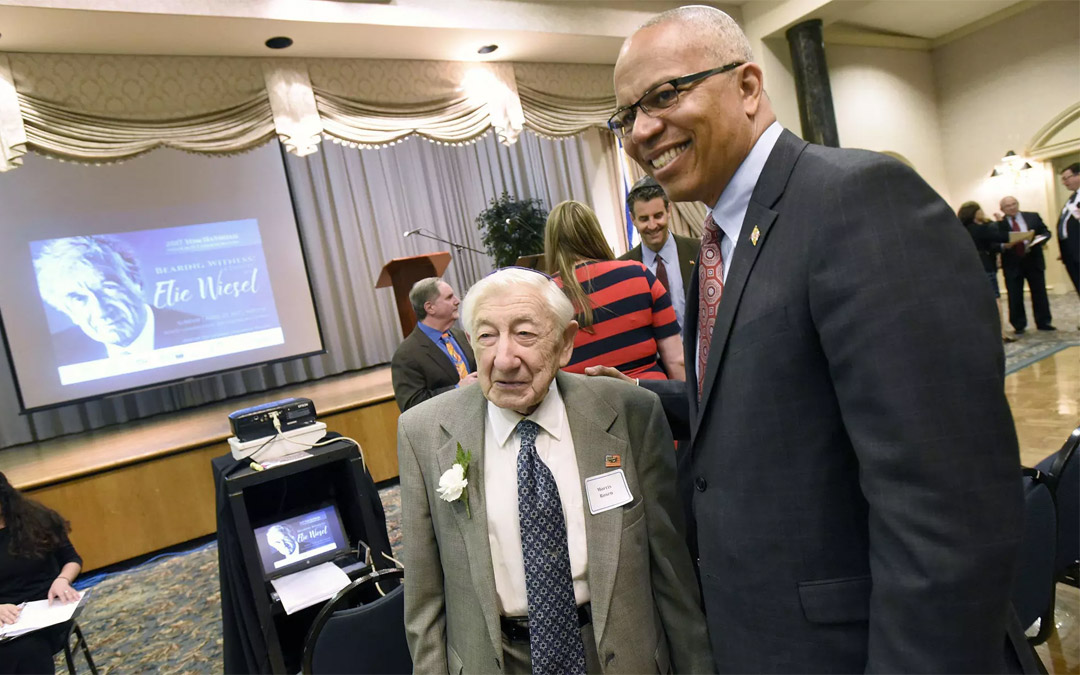 Local Holocaust survivor Morris Rosen (center) chats with Lt. Gov. Boyd Rutherford at a Yom Hashoah event in 2017 at Pikesville's Beth El Congregation. (Photo by Steve Ruark)