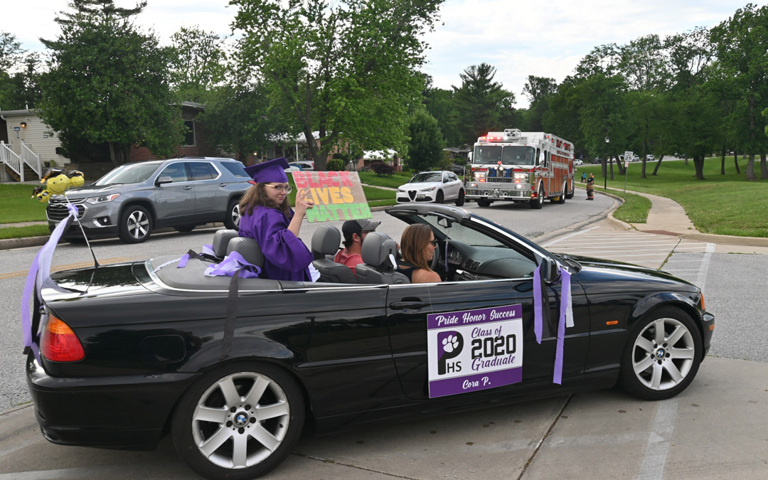 A convertible full of graduating seniors pulls into Pikesville High with signs expressing support for the “Black Lives Matter” movement. (Photo by Michael Schwartzberg/PVFC)