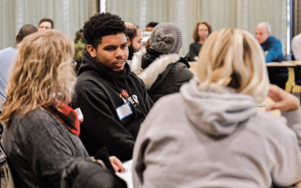 Community members discuss current issues impacting Baltimore on Martin Luther King Jr. Day.