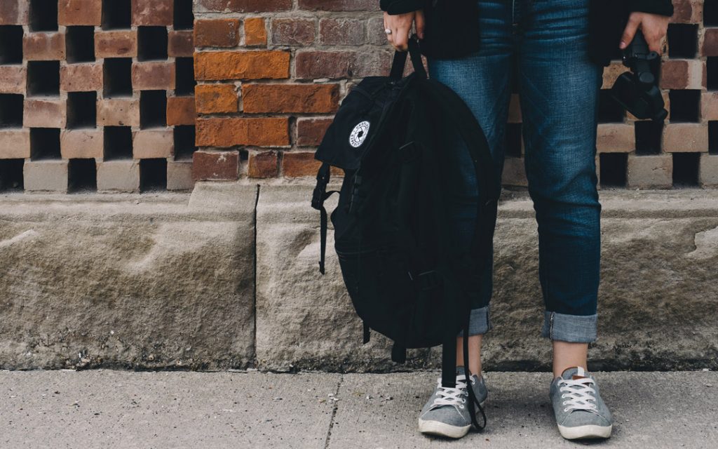 student with backpack