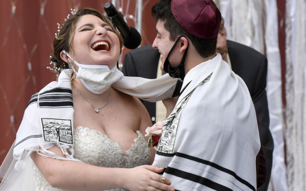 Lindsay and Ryan share a hearty laugh after renewing their vows.