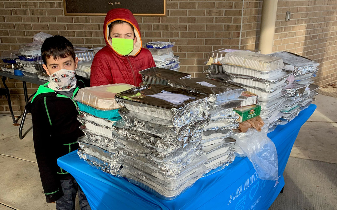 Young volunteers Micah (9) and Noah (7) Bloom helped collect casseroles at JVC's Dec. 1 "Casserole Challenge."