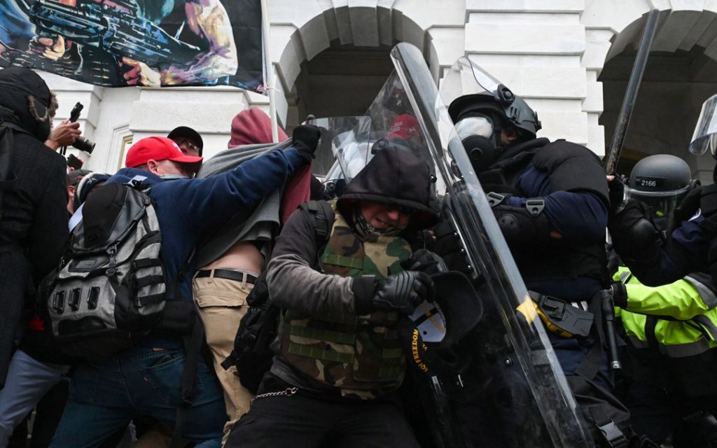 Riot police push back a crowd of supporters of President Donald Trump after they stormed the U.S. Capitol on Jan. 6.