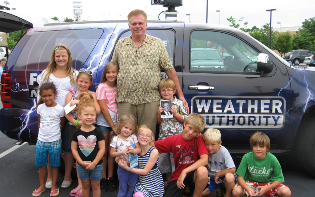 Tony Pagnotti (center) hangs out with some young fans and friends.