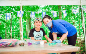 Camper Cameron Kachura (left) and counselor Shachar Cohen have fun at J Camps.