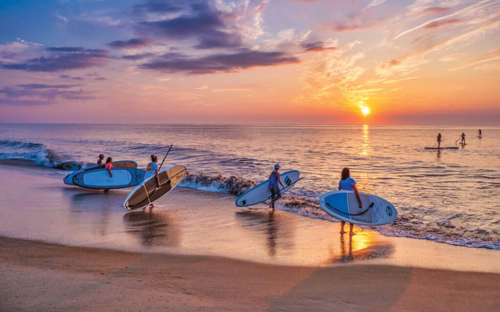 paddle boarders at Bethany Beach