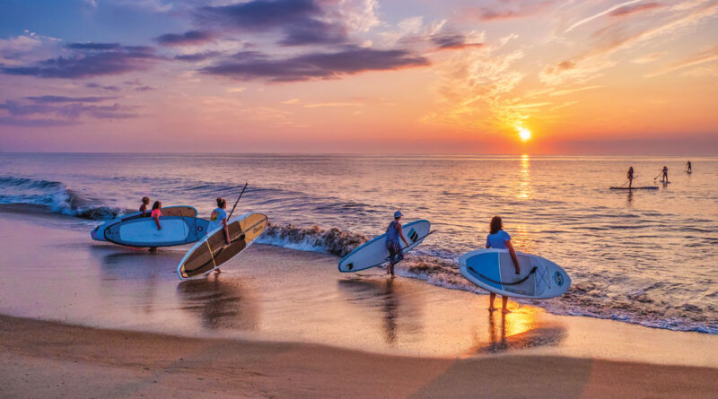 paddle boarders at Bethany Beach