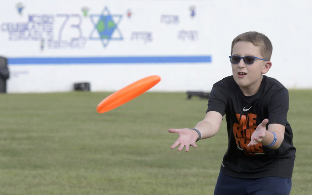 Asher Brook, 9, of Reisterstown, catches a flying disk during Chizuk Amuno Congregation's SummerFest.