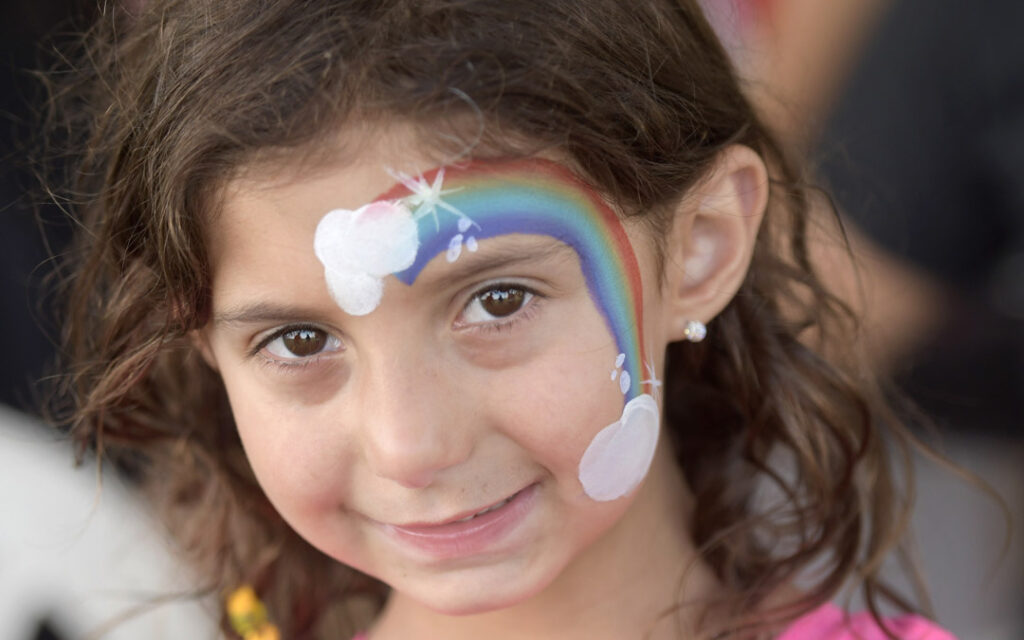 Lily Harryman, 5, of Reisterstown, shows off her face paint during Chizuk Amuno Congregation's SummerFest.