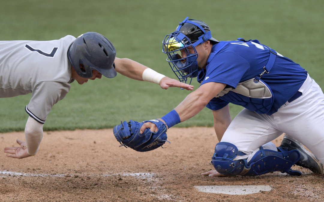 Team Israel catcher Ryan Lavarnway, right, who played Major League Baseball, including earlier this season for the Cleveland Indians, makes a tag at home plate during an exhibition against the Cal Ripken Collegiate All-Stars in Aberdeen. (Photo by Steve Ruark)