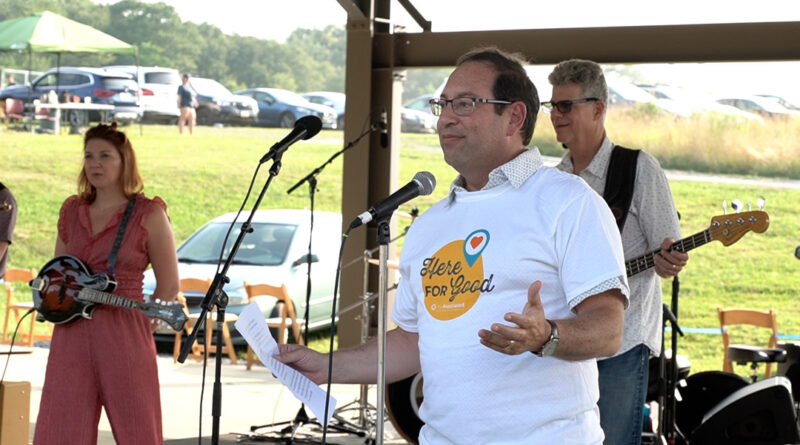 Jason A. Blavatt, development chair for The Associated's 2022 annual campaign, welcomes the crowd to Summer Music Fest.