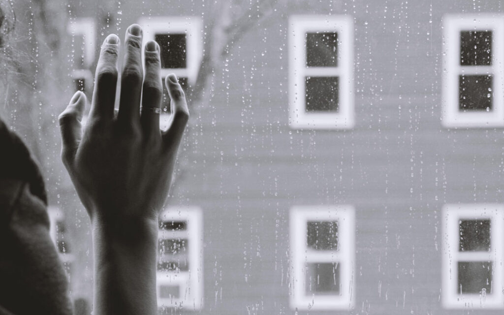 hand at window