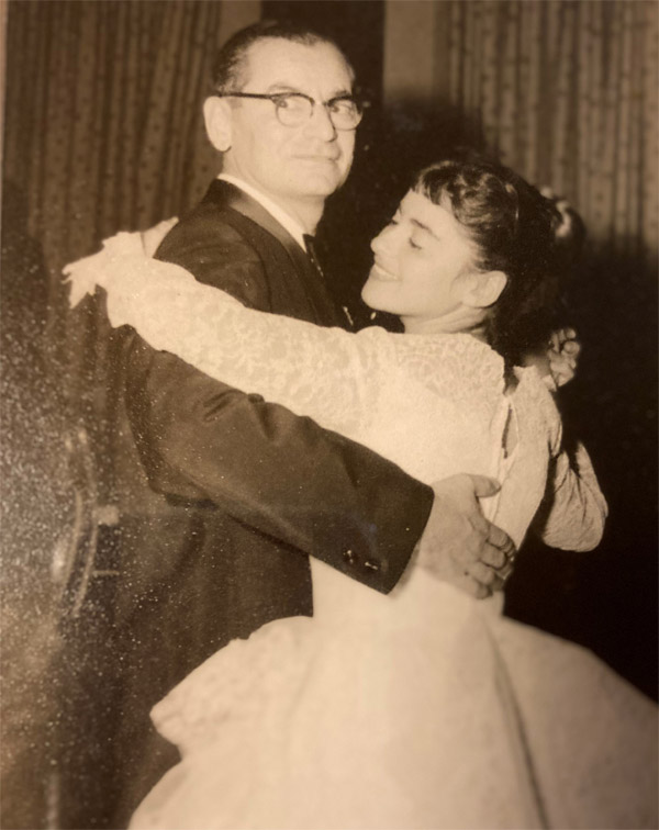 Ruth Grill dances with her father at her wedding