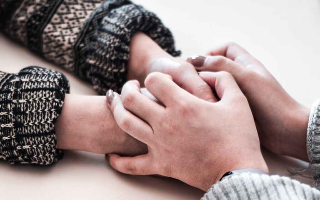 holding hand in comfort