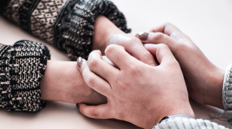 holding hand in comfort
