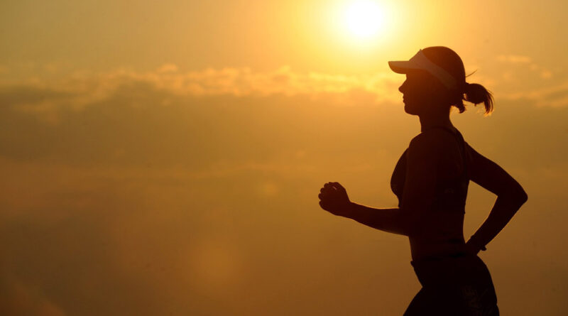 woman running at sunset