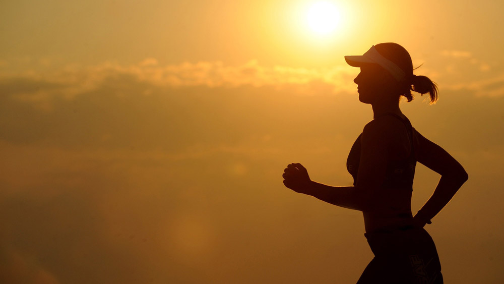 woman running at sunset