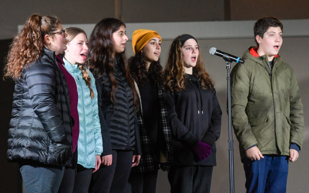 Members of HaZamir Baltimore teen choir perform during "Illumination Celebration: Chanukah Ignited" at the Owings Mills JCC. (Photo by Steve Ruark)