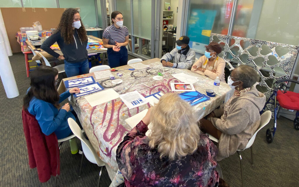 Atrium Village residents spent time with volunteer high school students at Art with a Heart painting flowers for a mural to be placed at My Sister's Place Women's Center in Baltimore.