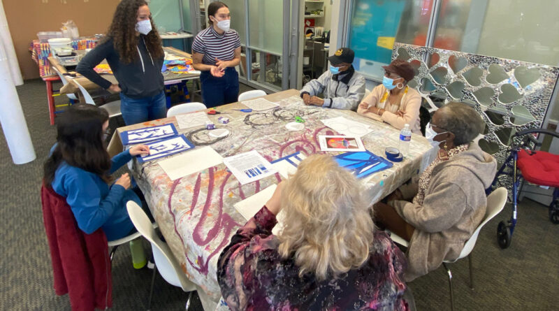 Atrium Village residents spent time with volunteer high school students at Art with a Heart painting flowers for a mural to be placed at My Sister's Place Women's Center in Baltimore.