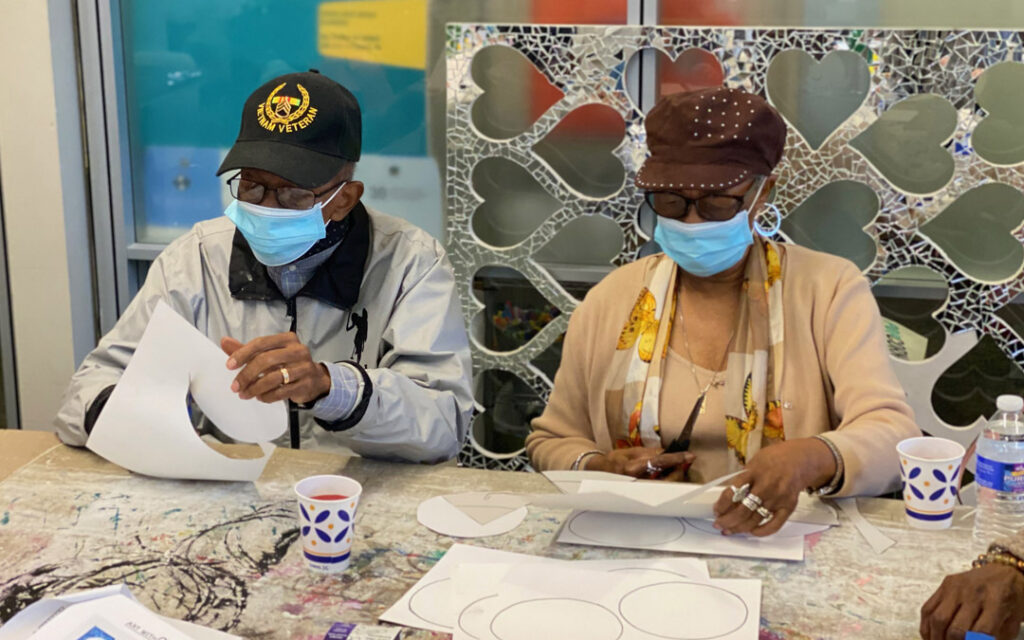 Atrium Village residents spent time with volunteer high school students at Art with a Heart painting flowers for a mural to be placed at My Sister's Place Women's Center in Baltimore.