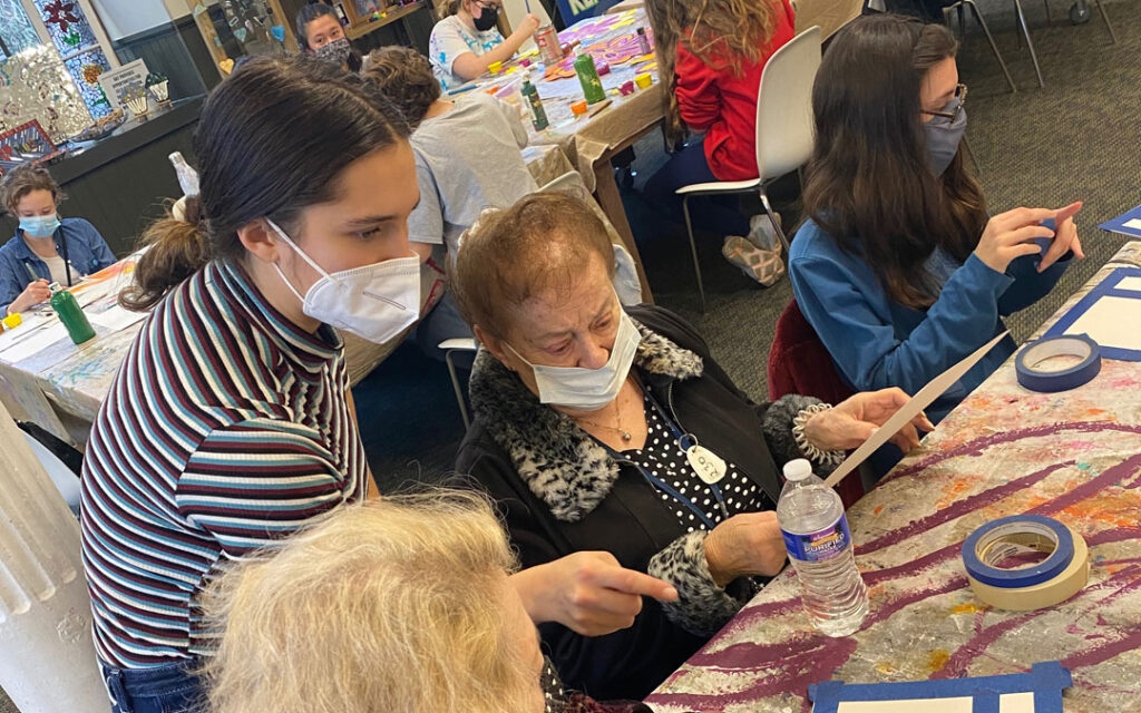 Atrium Village residents spent time with volunteer high school students at Art with a Heart painting flowers for a mural to be placed at My Sister's Place Women's Center in Baltimore.