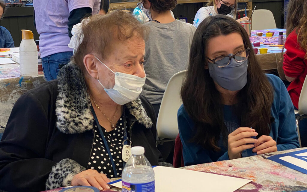 Atrium Village residents spent time with volunteer high school students at Art with a Heart painting flowers for a mural to be placed at My Sister's Place Women's Center in Baltimore.