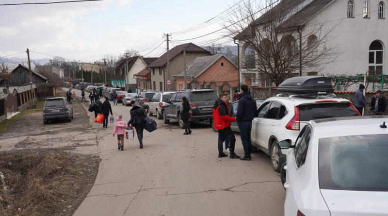 Cars wait to cross into Romania on Feb. 24 at the border crossing in the Ukrainian settlement of Solotvyno.