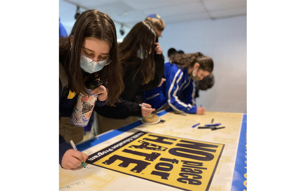 Beth Tfiloh students sign the "No Place for Hate" pledge.
