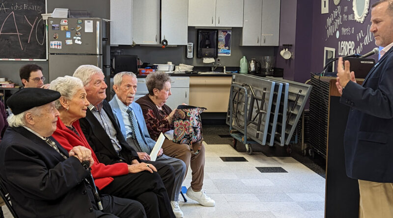 Barak Hermann (far right), chief executive officer of the JCC of Greater Baltimore, speaks to members and supporters of the JEA Fellowship Association.