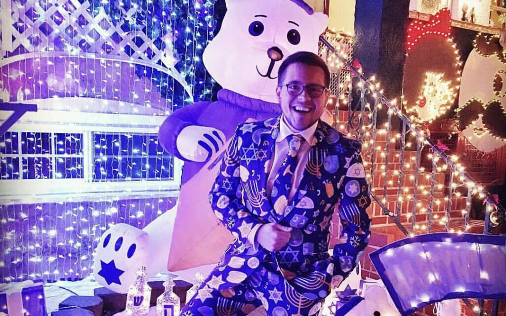 Joshua Lamont outside his Hampden Hanukkah House