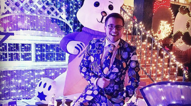 Joshua Lamont outside his Hampden Hanukkah House