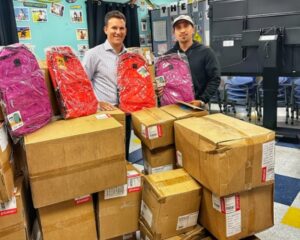 Acme Paper Vice President Scott Attman with a Boys and Girls Club of Greater Washington Representative