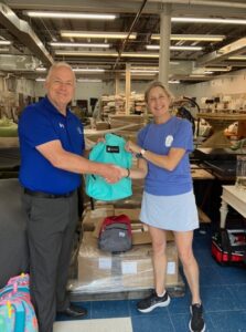 Acme Paper Regional Manager Joseph Kern with Backpack Buddies Coordinator Marcy Williams