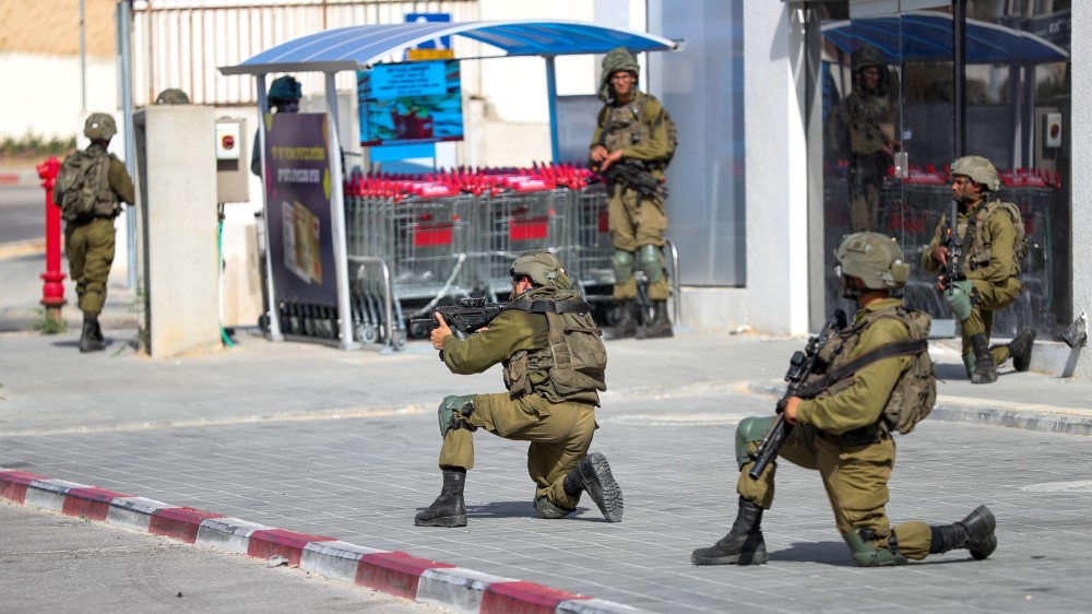 Israeli security forces search for Hamas militants in the southern Israeli city of Sderot