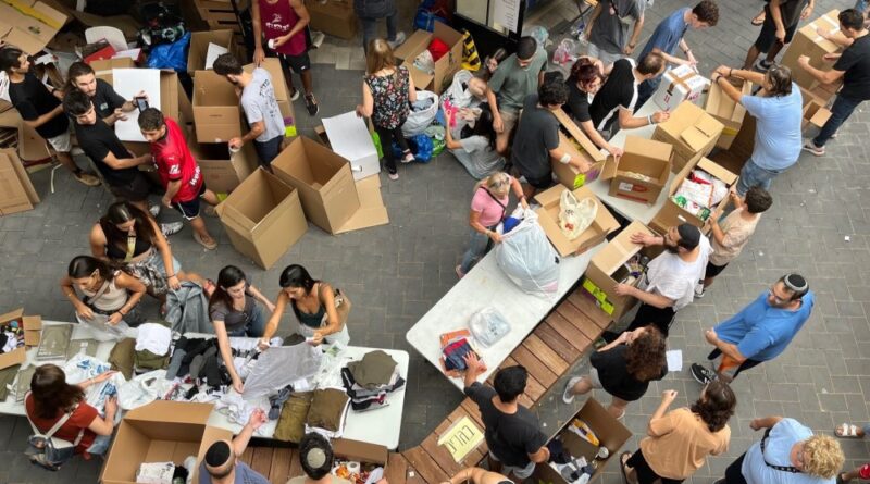 Donors are bringing clean clothes, mobile phone batteries, dry food and other products to volunteer collection points like this one in Modiin, Israel.