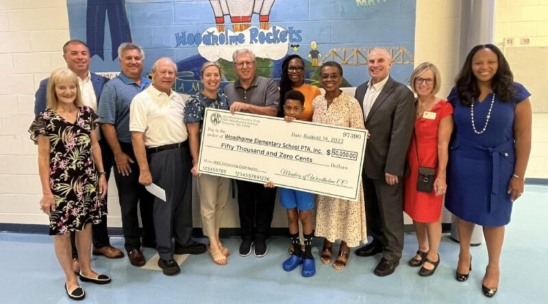 Woodholme Country Club's board of directors makes a $50,000 donation to Woodholme Elementary School