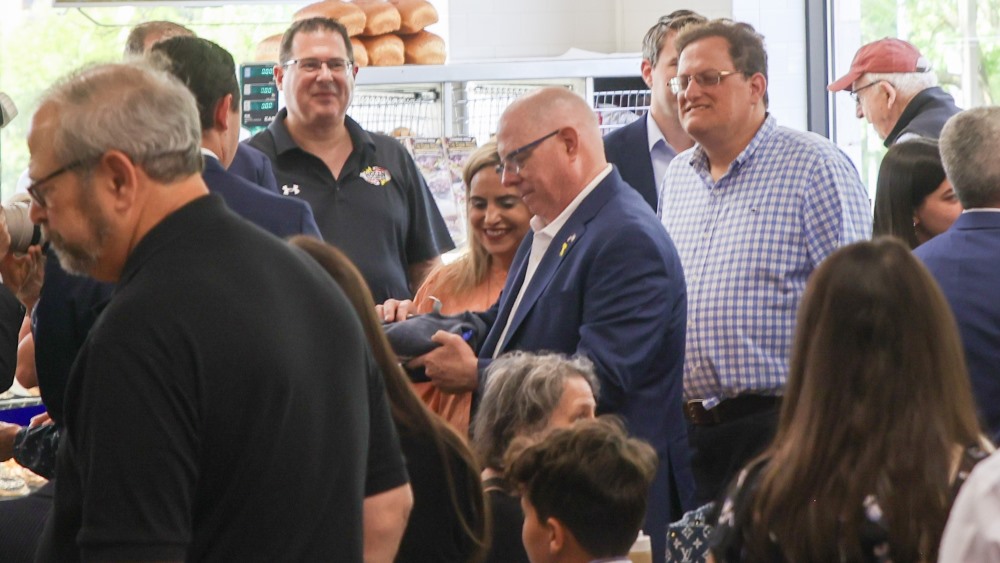 Larry Hogan looking at his gifts from the BZD.